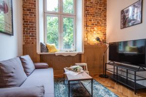 Televízia a/alebo spoločenská miestnosť v ubytovaní Tower Street Apartments