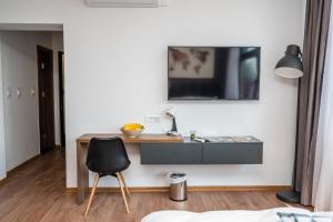 Televízia a/alebo spoločenská miestnosť v ubytovaní Modern and Bright Apartments - Main Street