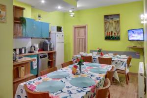 a dining room with a table and chairs in a kitchen at In Astra in Vilnius