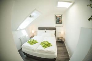 Postel nebo postele na pokoji v ubytování City Apartments FN L7 KLIMATISIERT-mit Küche