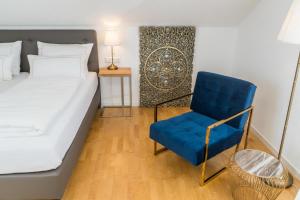 Postel nebo postele na pokoji v ubytování City Apartments FN L7 KLIMATISIERT-mit Küche