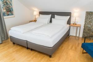 Postel nebo postele na pokoji v ubytování City Apartments FN L7 KLIMATISIERT-mit Küche