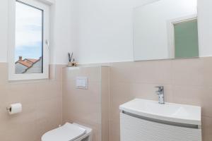 Kúpeľňa v ubytovaní Villa Elena Deluxe mit Whirlpool und beheiztem Pool am Meer und wunderschönen Blick auf die Brijuni Inseln