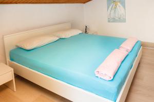 Postel nebo postele na pokoji v ubytování Apartments ORSIC