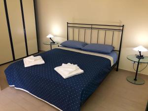 Katil atau katil-katil dalam bilik di Capo Taormina House
