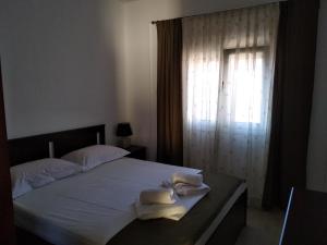 Postel nebo postele na pokoji v ubytování Stef Lux Home of Kriopigi
