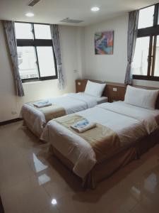Katil atau katil-katil dalam bilik di Frank B&B