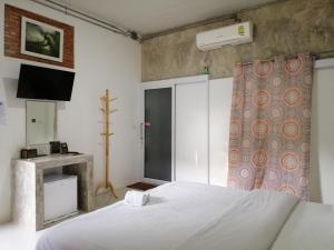 Postel nebo postele na pokoji v ubytování เพ็ญวิวรีสอร์ท Phenview resort