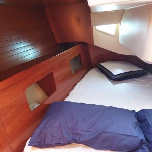 a small bed in a cabin on a boat at Bed & Boat Holiday in La Spezia