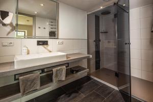 a bathroom with a sink and a shower at Ferienwohnungen am Gablerhof in Bad Reichenhall +38 photos