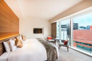 Postel nebo postele na pokoji v ubytování karaksa hotel premier Tokyo Ginza