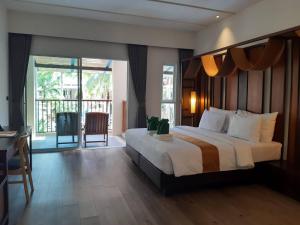 A bed or beds in a room at Ayara Villas - SHA Extra Plus