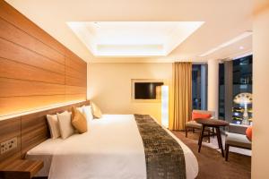 Postel nebo postele na pokoji v ubytování karaksa hotel premier Tokyo Ginza + 37 fotografií
