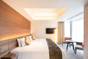 Postel nebo postele na pokoji v ubytování karaksa hotel premier Tokyo Ginza