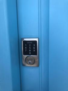 a close up of a door knob on a blue door at Mykonian Mews Luxury Suites in Psarou