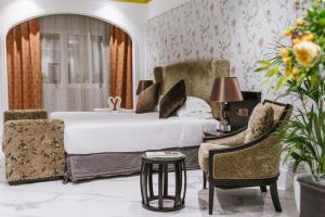 Postel nebo postele na pokoji v ubytování Mangrove Hotel