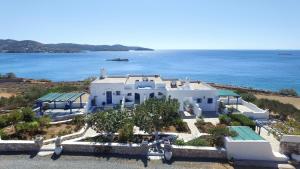 an aerial view of a white house by the ocean at Sea View Studios in Finikas