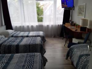 Postel nebo postele na pokoji v ubytování Hotel Baan
