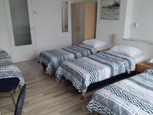 Postel nebo postele na pokoji v ubytování Hotel Baan