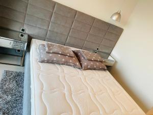 Postel nebo postele na pokoji v ubytování Sunset Drive 135