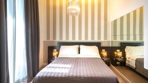 Posteľ alebo postele v izbe v ubytovaní Perla Verde Hotel