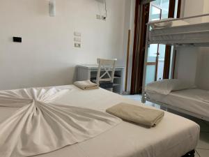 Postel nebo postele na pokoji v ubytování B&B Gli Archi