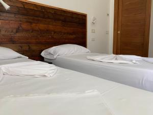 Postel nebo postele na pokoji v ubytování B&B Gli Archi