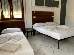 Postel nebo postele na pokoji v ubytování B&B Gli Archi