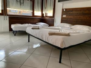 Postel nebo postele na pokoji v ubytování B&B Gli Archi
