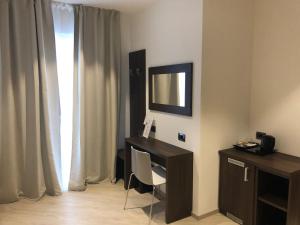 TV a/nebo společenská místnost v ubytování Hotel Villa Rosa