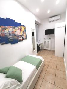 Posteľ alebo postele v izbe v ubytovaní I Tesori di Napoli