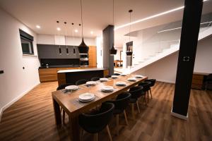 a large dining room with a long table and chairs at Villa Estate in Novalja