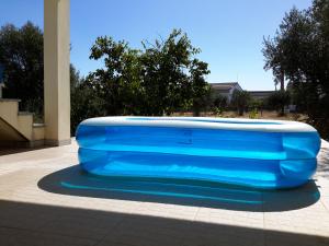 a large blue object is sitting on a sidewalk at Villa Ortiga in Mação
