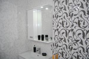 a bathroom with a white sink and a mirror at RI-VAL in Valandovo +67 photos