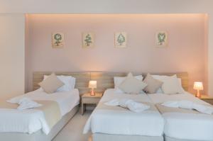 Voodi või voodid majutusasutuse Poseidon Beach Hotel toas