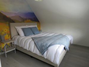 מיטה או מיטות בחדר ב-Kitrino
