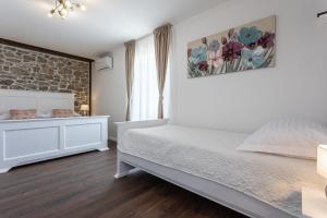 Posteľ alebo postele v izbe v ubytovaní Villa Frana