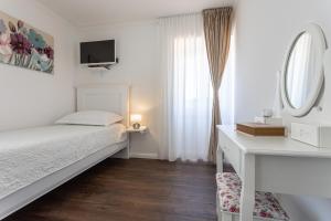 Posteľ alebo postele v izbe v ubytovaní Villa Frana