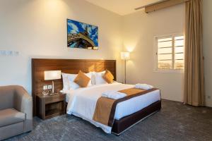 Säng eller sängar i ett rum på Seiba Hotel Apartments-Riyadh