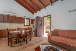 a living room with a couch and a table at Kerithra Villa in Vasiliki