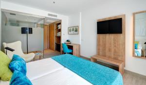 Een bed of bedden in een kamer bij Hotel Moré