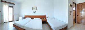 Postel nebo postele na pokoji v ubytování Hotel Ermioni