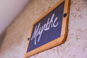 a sign on a wall with the word mitzulic at Prea Gianca in Bonifacio