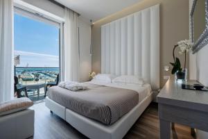 Postel nebo postele na pokoji v ubytování Hotel Stella D'Oro