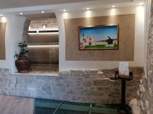 TV a/nebo společenská místnost v ubytování Camere Santa Chiara
