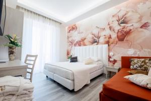 Postel nebo postele na pokoji v ubytování Hotel Stella D'Oro