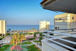 a view of the ocean from a balcony of a building at Urbanova Alicante in El Alted