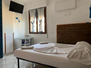 Postel nebo postele na pokoji v ubytování B&B Gli Archi
