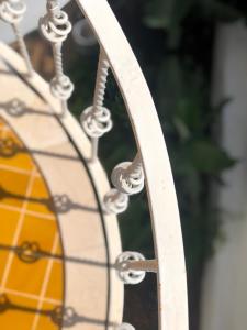 a close up of a metal wheel with water drops at Kekova Hotel in Kaş