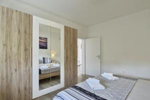 Postel nebo postele na pokoji v ubytování VILLA ALEXANDRIA